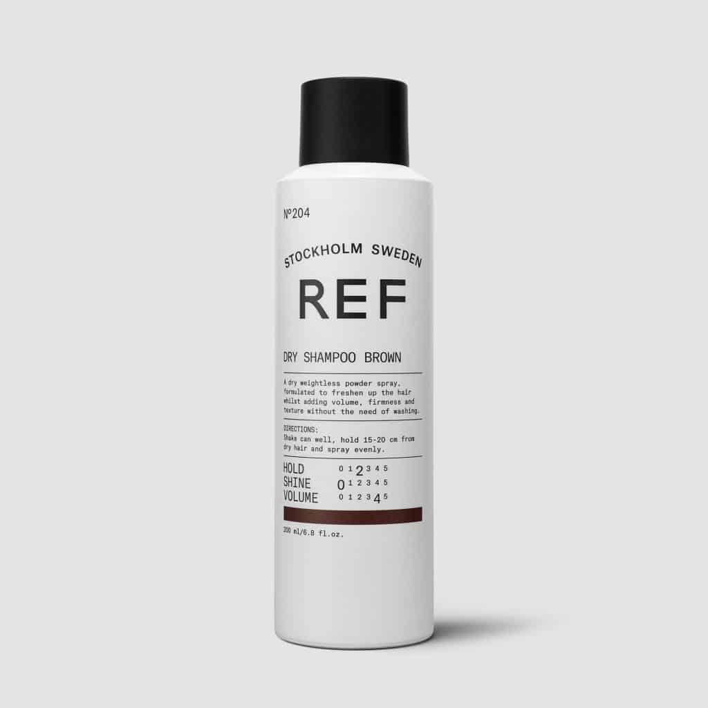 REF Dry Shampoo Brown N°204: A dry weightless powder spray formulated to freshen up hair. Dry spray shampoo with brown pigments. Gives volume, texture &amp; refreshes hair between washes, removes oil from scalp. 100% Vegan, Paraben free, Sulphate free. Color preserving. 1234