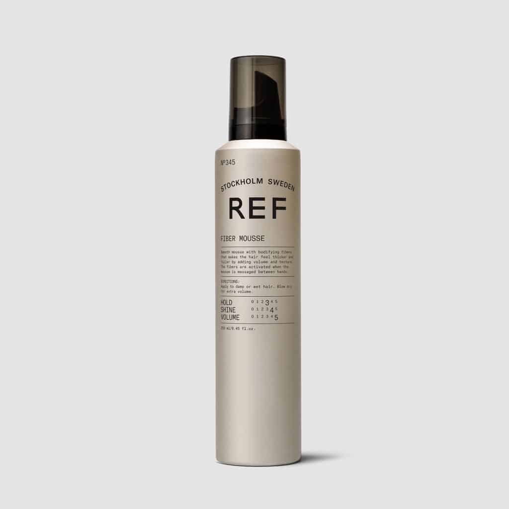 REF Fiber Mousse N°345: A smooth mousse with active fibers that makes hair thicker and fuller, adding volume and texture from root to end.  Activated when mousse is massaged between hands. Natural heat protection, long lasting hold and a natural shine. 100% Vegan, Paraben free, Sulphate free. Color preserving.1234